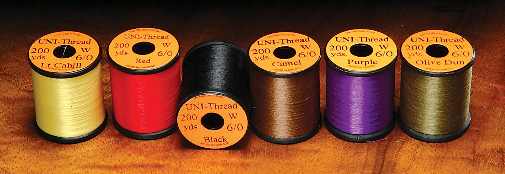 Uni 6 0 Waxed Thread spools in assorted colors by Hareline Dubbin, Inc for fly tying at Freestone Fly Shop