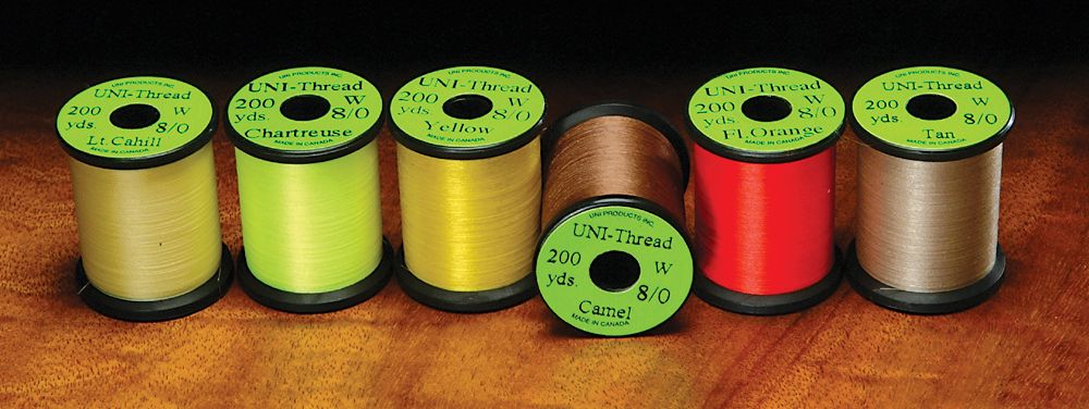Uni 8 0 Waxed Thread spools in assorted colors by Hareline Dubbin, Inc for fly tying at Freestone Fly Shop